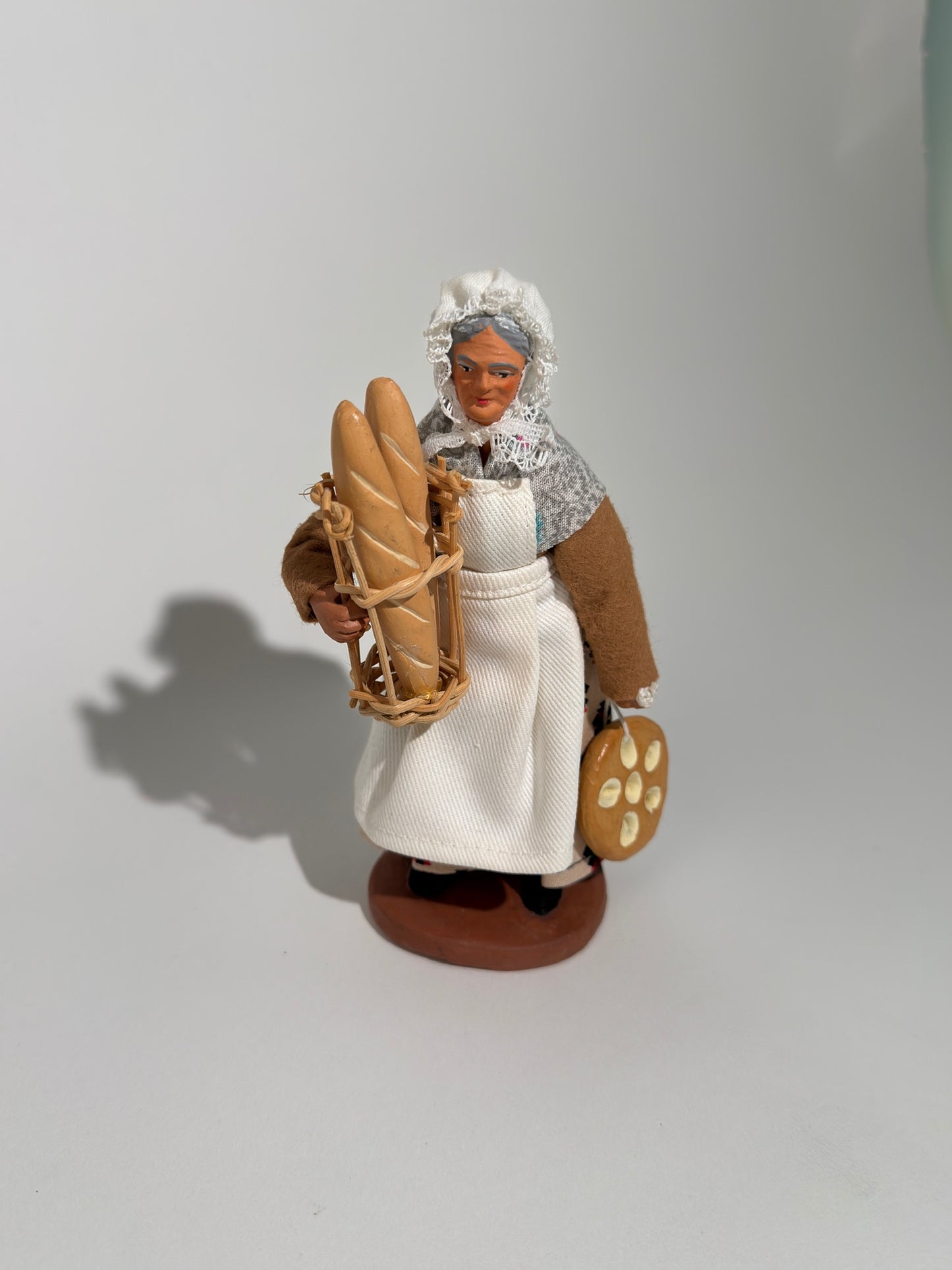 Clay Woman Baker Figurine