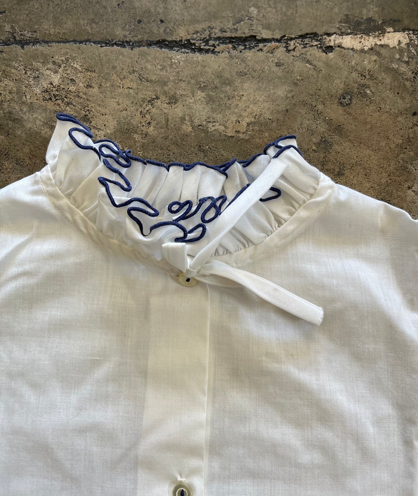 White Ruffle Navy Trim Blouse