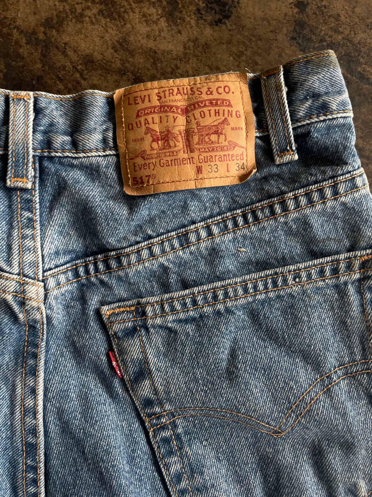 Distressed Levis 517 Boot Cut Blue Jeans