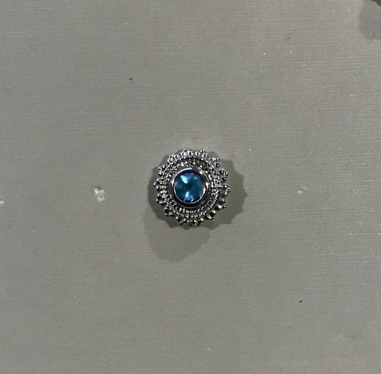 Threaded Round Afghan 8mm-3mm Bezel In Center Blue Topaz